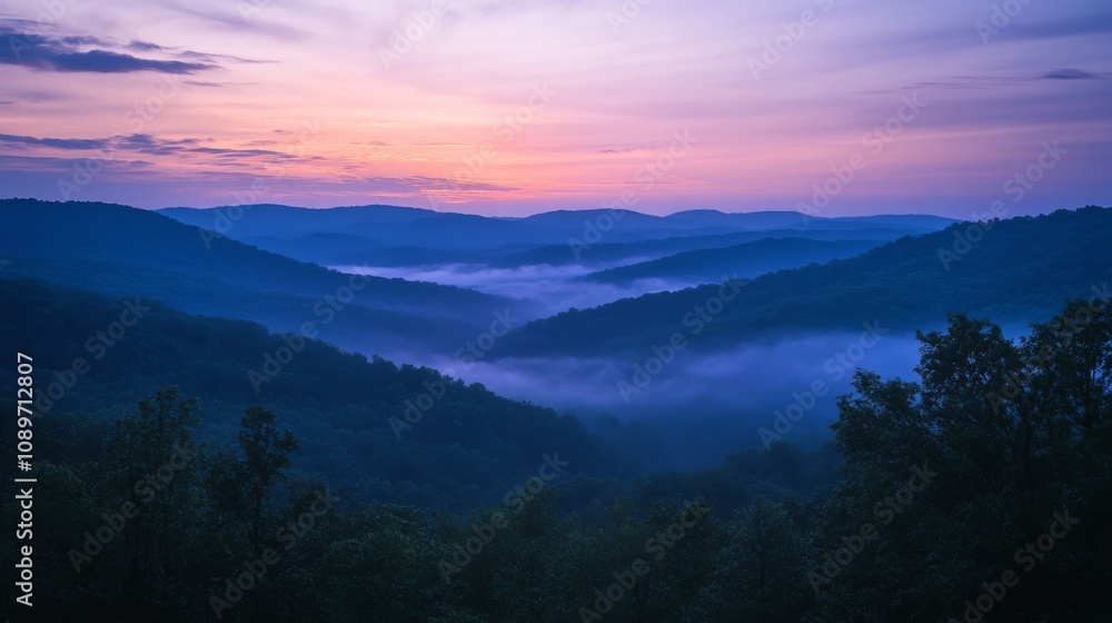Obraz premium Serene Mountain Mist At Sunrise Over Rolling Hills