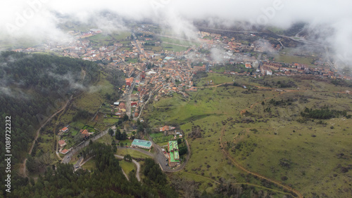 Cistierna, spain, surrounded by mountains and forests, seen from above
