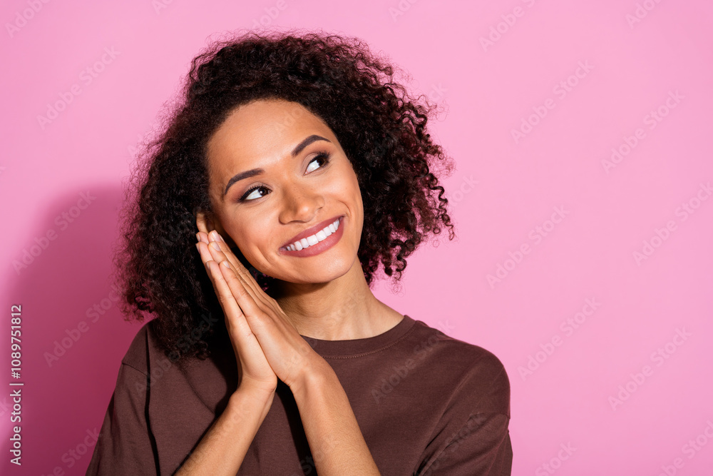 Portrait of pretty young lady look empty space wear brown t-shirt isolated on pink color background Portrait of pretty young lady look empty space wear brown t-shirt isolated on pink color background