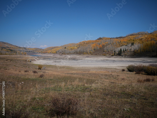 View of Silver Jack Reservoir on Owl Creek Pass surrounded by fall colors in Uncompahgre National Forest near Montrose Colorado photo