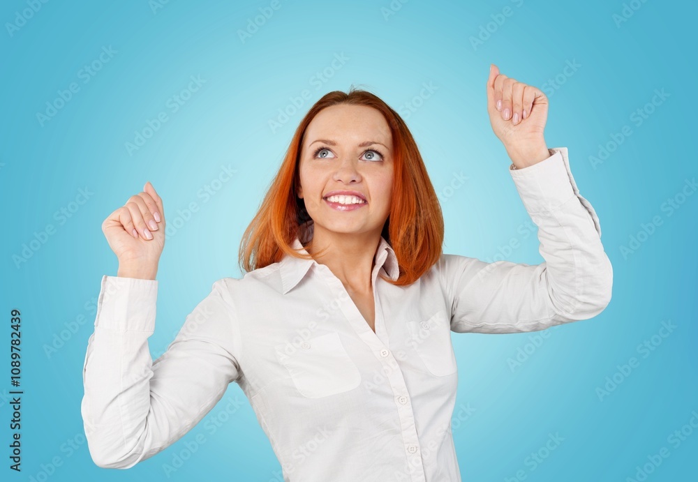 Young excited woman doing winner gesture Young excited woman doing winner gesture