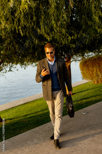 A stylish man enjoys a leis...