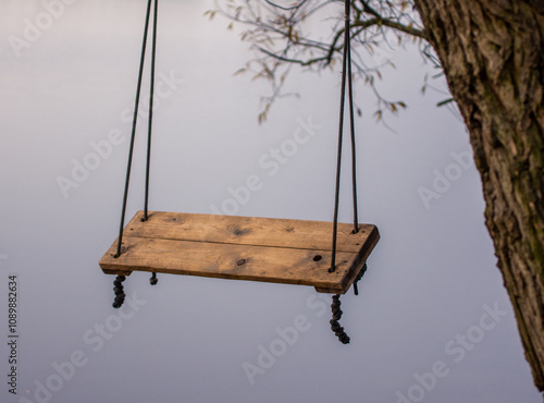  swing on ropes suspended above the fog, swinging over an abyss