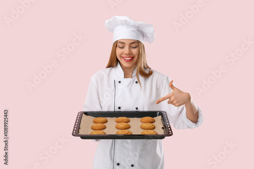 Young female chef pointing ...