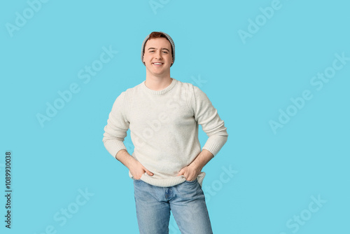 Happy young man in hat on b...