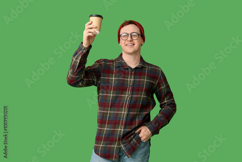 Young man in hat and with c...