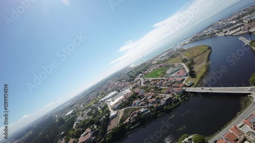 Flying an FPV drone in an old European city on the Atlantic Ocean over an aqueduct and an old fortress_05 photo