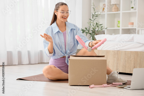 Sporty young woman taking e...