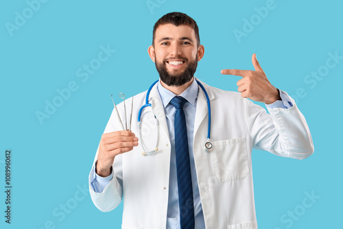 Happy male dentist with pro...