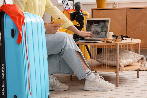 Female travel blogger with ...