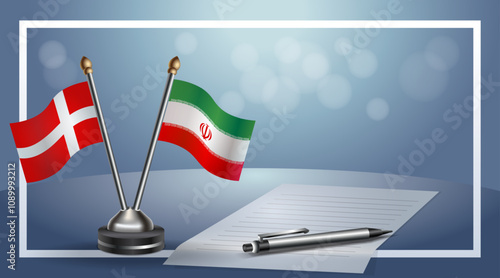 Denmark and Iran National flags on small table with bokeh background, cooperative relationship