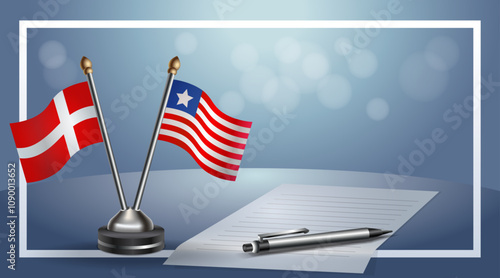 Denmark and Liberia National flags on small table with bokeh background, cooperative relationship