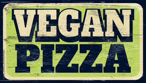 Aged retro vegan pizza sign on wood