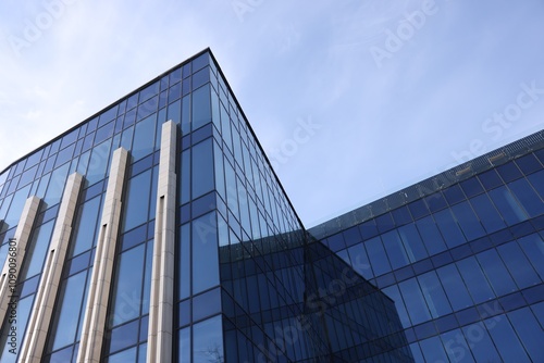 Exterior of modern building with many windows outdoors, low angle view