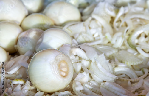 cleaned pealed raw white onions , full and cut slices photo