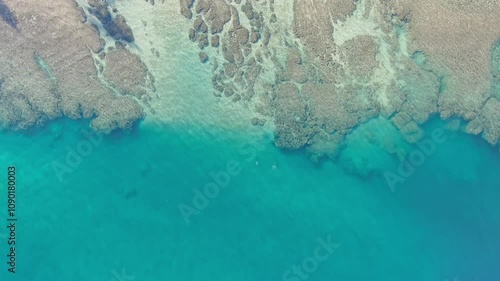 Stunning aerial shot of Tunnels Beach at sunrise, showcasing the pristine waters and vibrant Kauai landscape photo