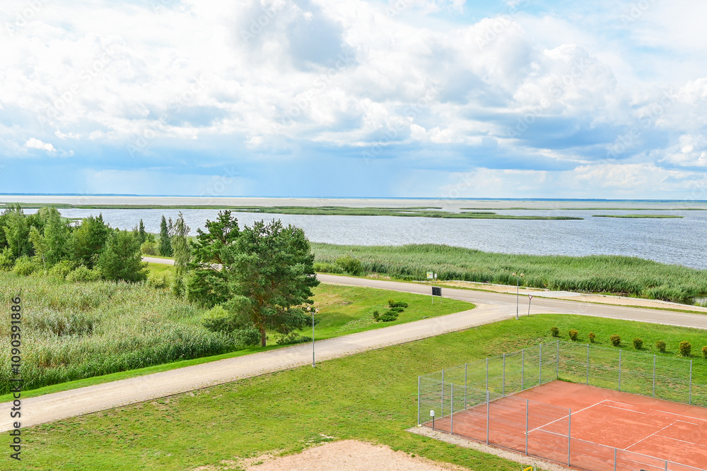 Fototapeta premium Panoramic view over Lake Luban, Lubanas ezers, from the viewpoint Udens Turisma Attistibas Centrs Baka - Summer lake landscape of the largest lake in Latvia, Vidzeme/Latgale