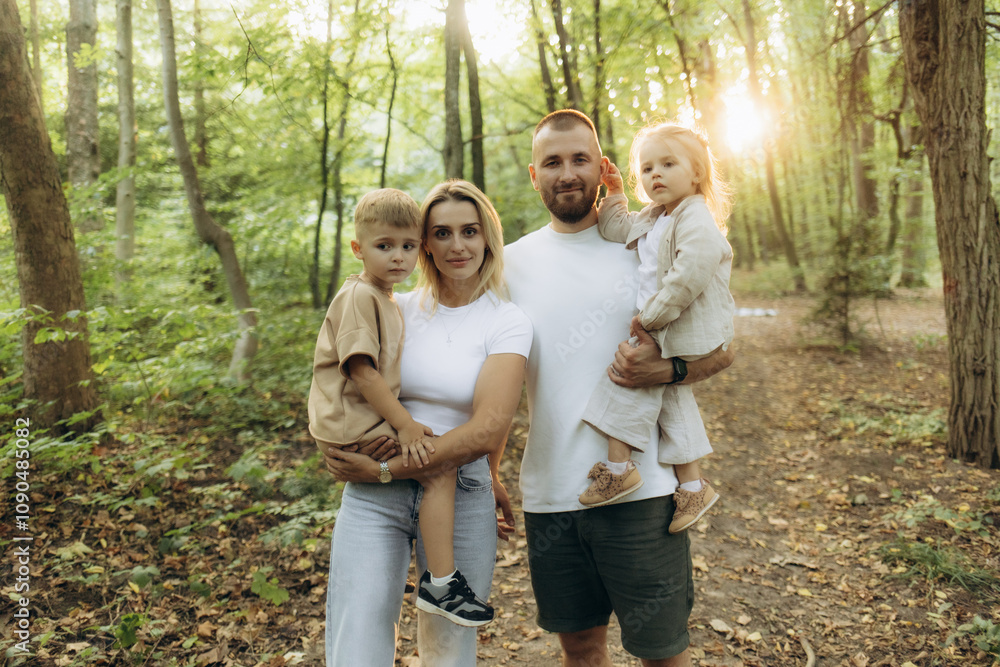 Fototapeta premium It's time for family quality time. Parents spending time with their children outside..