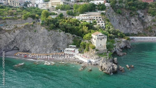 Aerial view of rocky coastline and beach of Vietri Sul Mare on a sunny summer day, Raite, Salerno, Italy