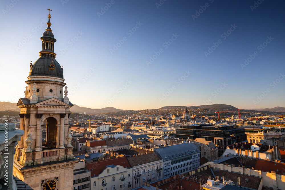 Obraz premium Budapest from above during sunset, view from Saint Stephen Cathedral. Travel to Hungary. Beautiful sunset over Budapest.
