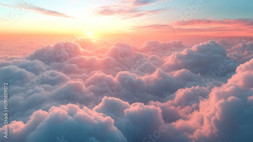 A breathtaking view of a vibrant sunrise over a sea of fluffy clouds.