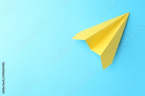 Wallpaper Mural One handmade yellow paper plane on light blue background, top view. Space for text Torontodigital.ca