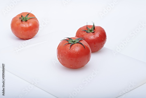 Photo of fresh fruit or vegetables on a light or white background with the freshness of dew