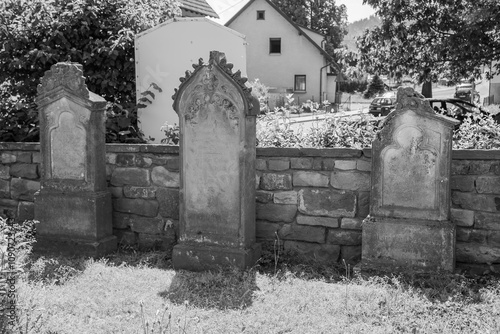 Alte Grabsteine an der Wallfahrtskirche Maria Hilf in Moosbronn bei Bad Herrenalb in Baden-Württemberg	 photo