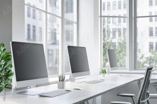 Wallpaper Mural Modern office with computer monitors on desks near large windows, bright workspace Torontodigital.ca