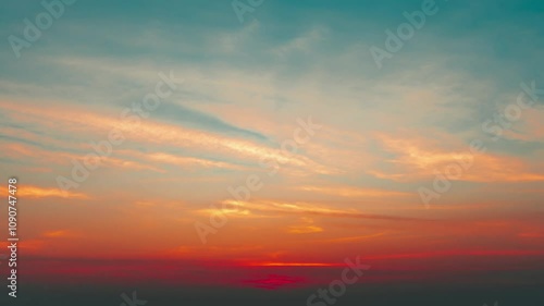 Tropical beach with sky with clouds above the ocean at colorful sunset 4K