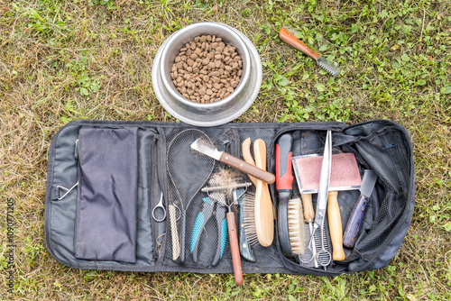 Grooming tools laid out for Dog haircut preparation photo