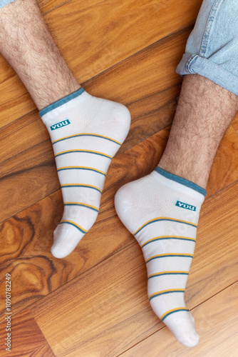 Quadro su tela Man in white socks with stripes