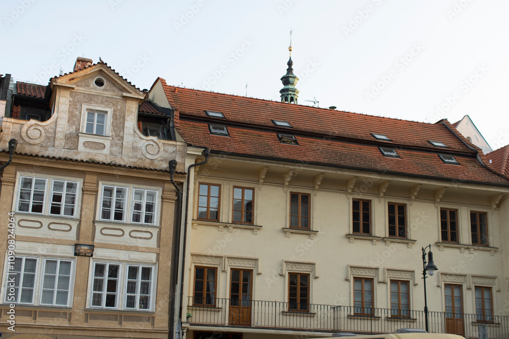 Obraz premium A picturesque row of historic European buildings that beautifully showcase intricate architectural details and traditional roofing styles, capturing the essence of the citys rich heritage