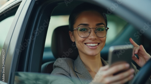 Woman Smiling and Chatting on Smartphone During Car Ride