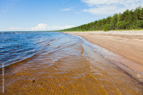 crystal clear water on a large sea beach.