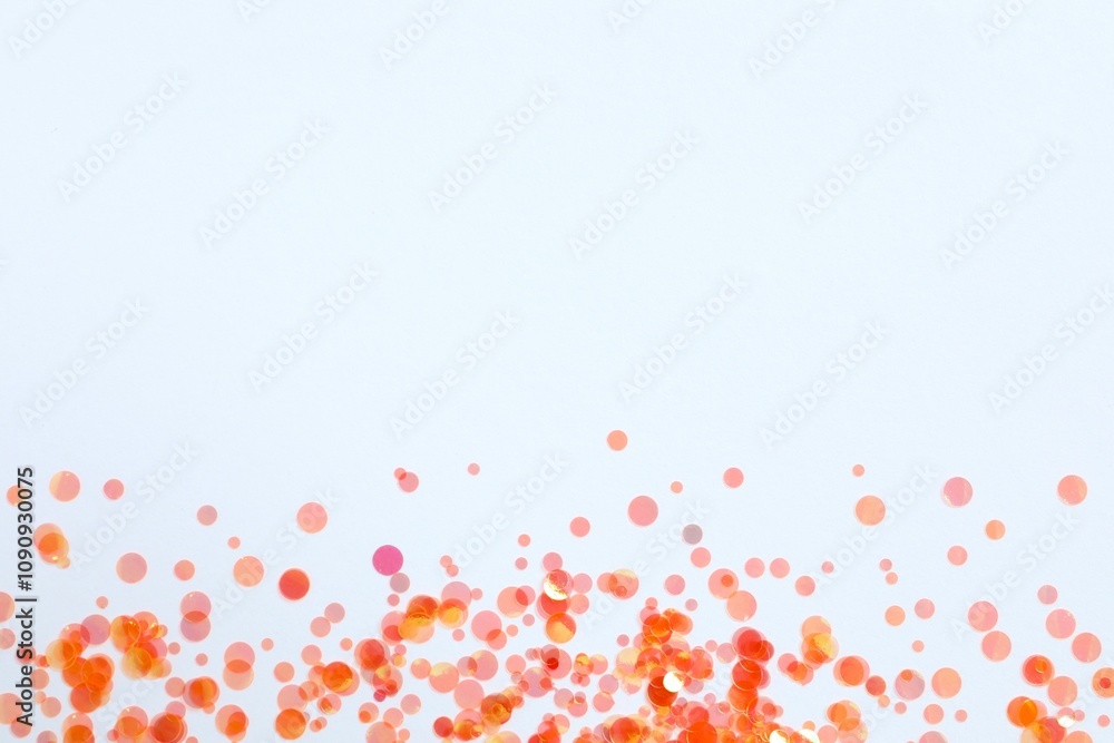 Fototapeta premium Beautiful orange confetti on a white background