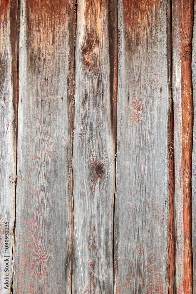Fototapeta premium Alte verwitterte Bretter ab einer Wand, texturiertes Holz, Hintergrund mit vertikalen Linien