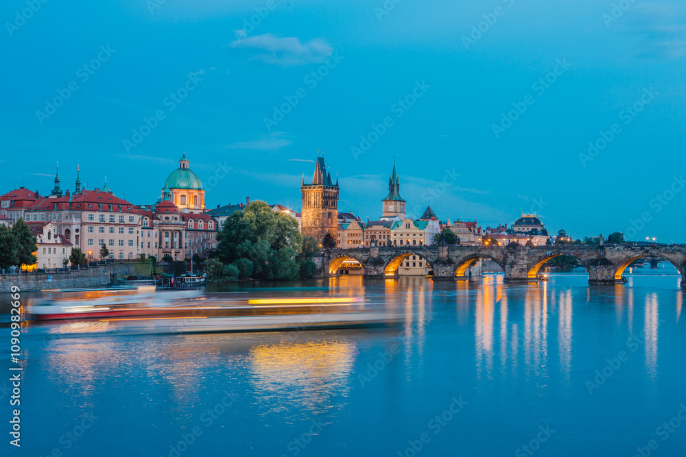 Fototapeta premium Karlův most - Charles Bridge (Arch bridge) in Prague, at dusk - sunset