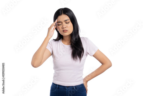 Beautiful young Asian woman suffering from headache with a frustrated expression isolated on white background photo