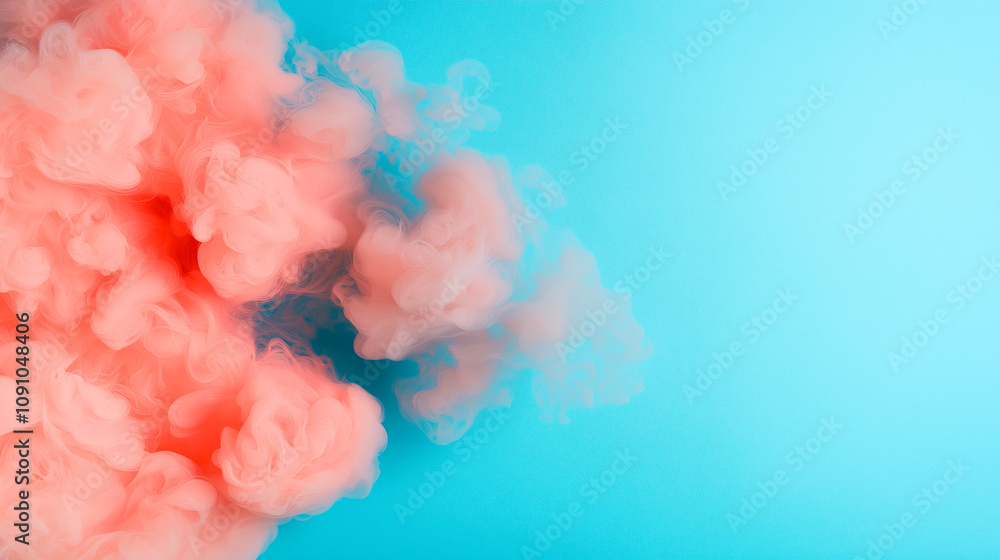 Fototapeta premium vibrant cloud of pink smoke swirls against bright blue background, creating dynamic and colorful abstract scene. contrast between colors adds sense of movement and energy