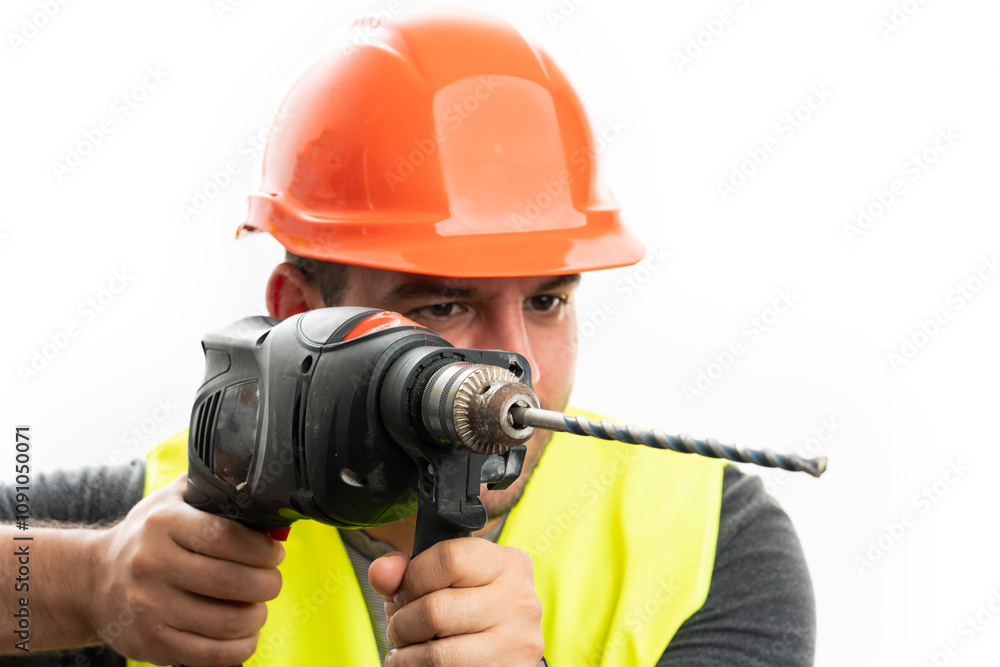 Close-up of male constructor using cordless power drill Close-up of male constructor using cordless power drill
