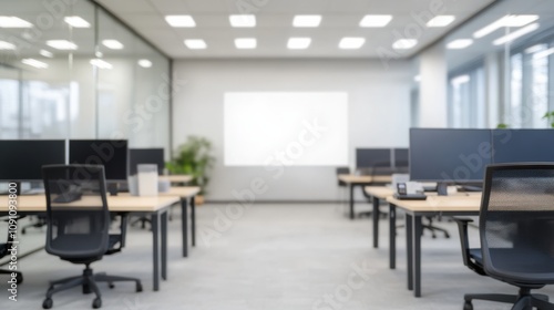 Wallpaper Mural A modern office space featuring multiple workstations, large windows, and a projector screen, promoting a bright and collaborative environment. Torontodigital.ca