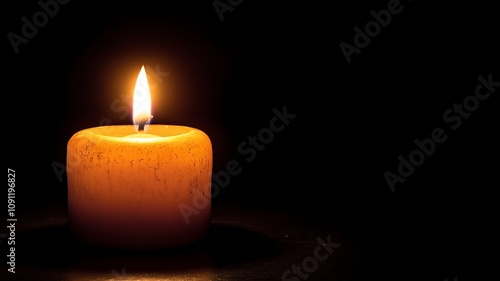 Single Candle Illuminating a Dark Room with Soft Glow.