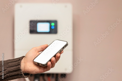 Solar Inverter Wi-Fi Monitoring on Mobile Application concept. Connect Solar Inverter and Mobile App on Smart Phone to WiFi. Copy Space for Text.