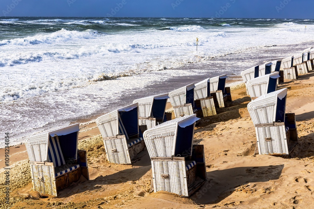 Beach chairs washed away by storm surges on the beach on the island of Sylt