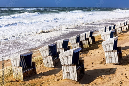 Obraz na płótnie Beach chairs washed away by storm surges on the beach on the island of Sylt w salonie