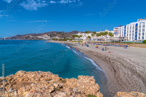 Nerja beach Spain Chucho Playa de Playazo Costa del Sol Spain Andalusia blue mediterranean sea and waves photo