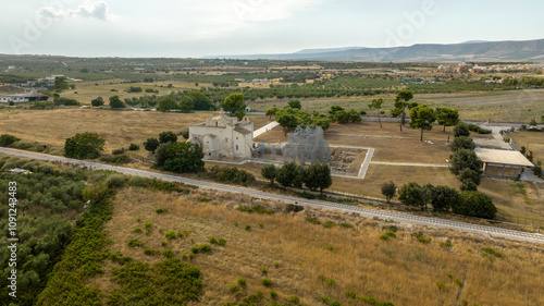 Aerial view of the Basilica of Santa Maria Maggiore di Siponto (Holy Virgin of Siponto). It is a church located near Manfredonia, in the province of Foggia, Puglia, Italy. photo