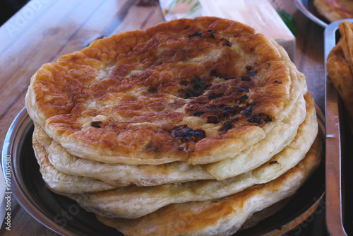 A Traditional Uyghur bread naan, tea egg, boiled corn and sweet potato in Xinjiang, healthy eating of local food inChina, Street food. photo