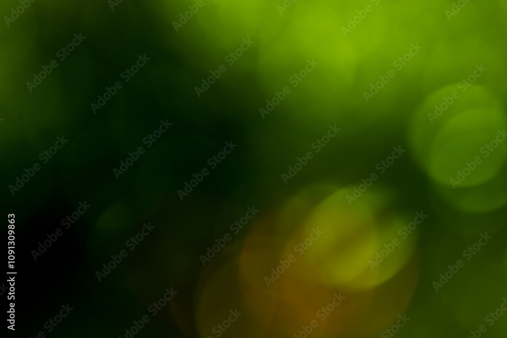 Obraz premium arrière plan png, avec bille de bokeh dans les tons vert avec de l'orange, pour ressources graphiques